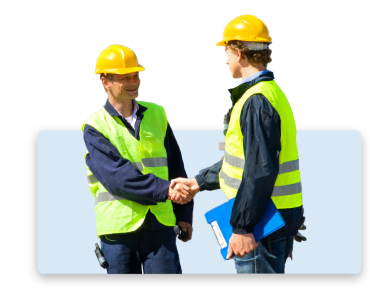 An image of two engineers shaking hands.